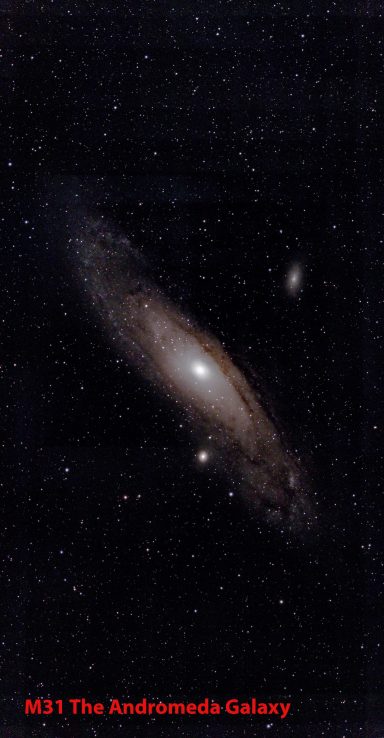 A spiral galaxy with bright core and surrounding stars against a dark backdrop.